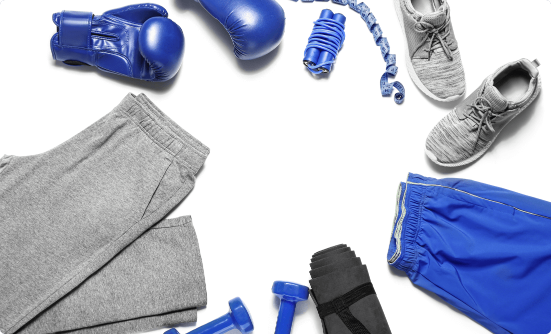 List of essential gym gear including a pair of grey trainers, boxing gloves, gym matt, gym shorts, dumbbells and a skipping rope.