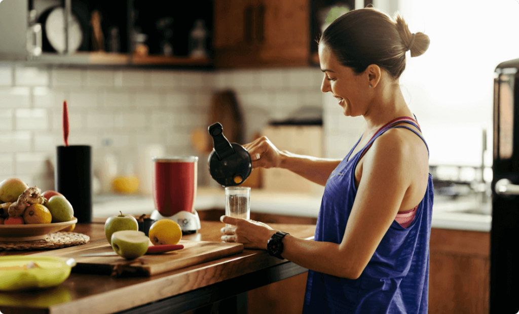 A girl making a fruit smoothy