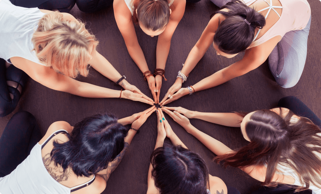 A group of girls posing to support community