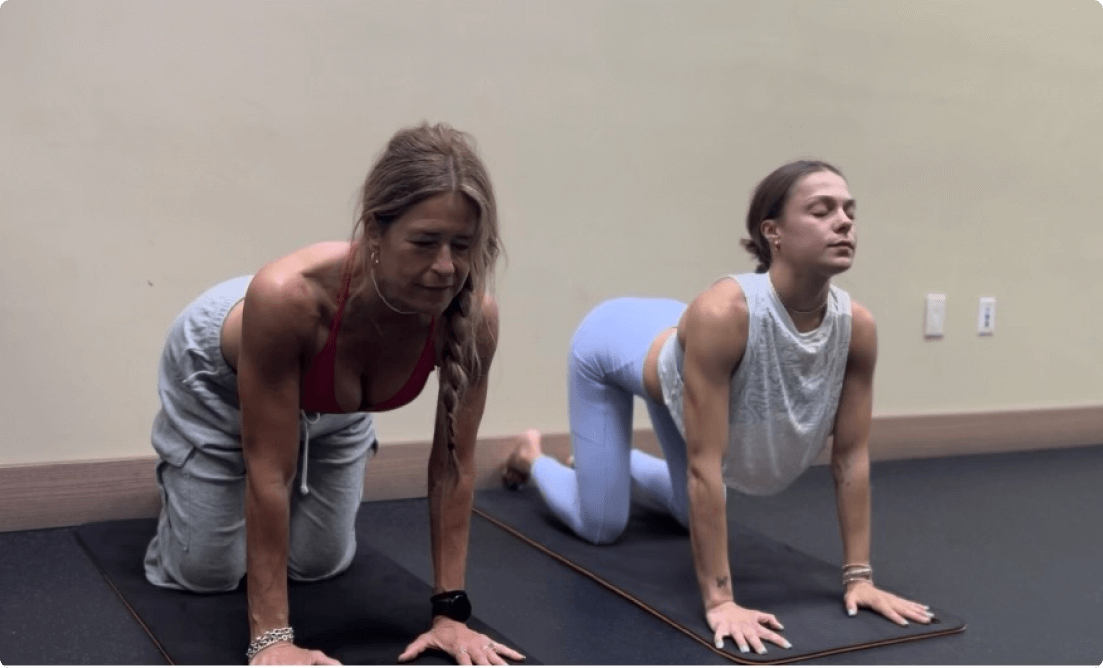 Girls practising Cat-Cow stretch