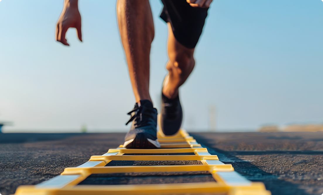 An athlete doing agility ladder drills.
